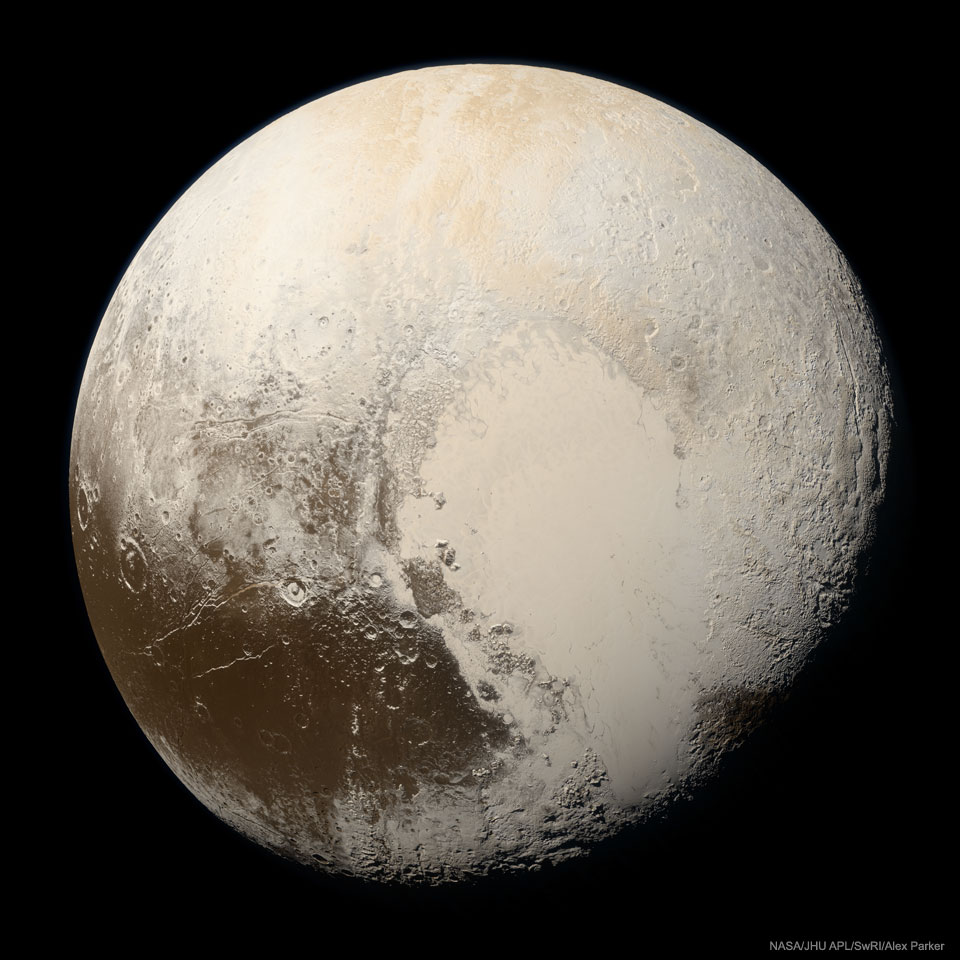 The minor planet Pluto is shown up close, as seen by
the passing New Horizons spacecraft, and in true colour. Pluto
is a complex mix of beige regions and some dark brown regions. 
Please see the explanation for more detailed information.