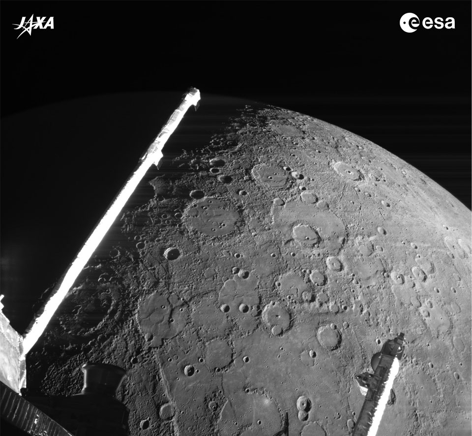 The featured image shows the heavily cratered surface
of Mercury with parts of ESA's and JAXA's passing robotic
BepiColombo in the foreground. 
Please see the explanation for more detailed information.