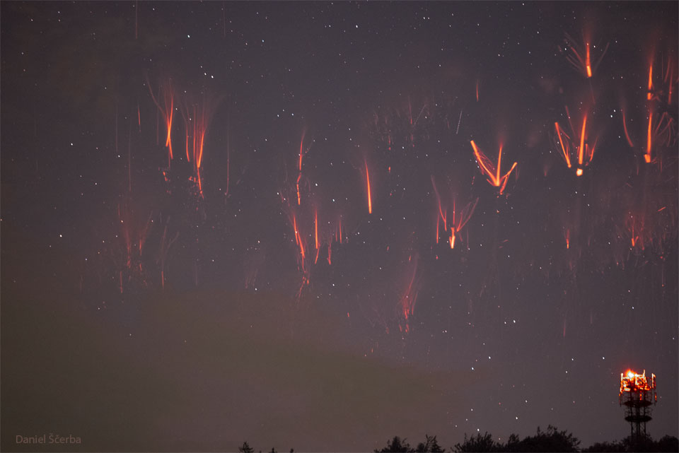 The featured image shows a dark sky with many
complex red streakes. 
Please see the explanation for more detailed information.